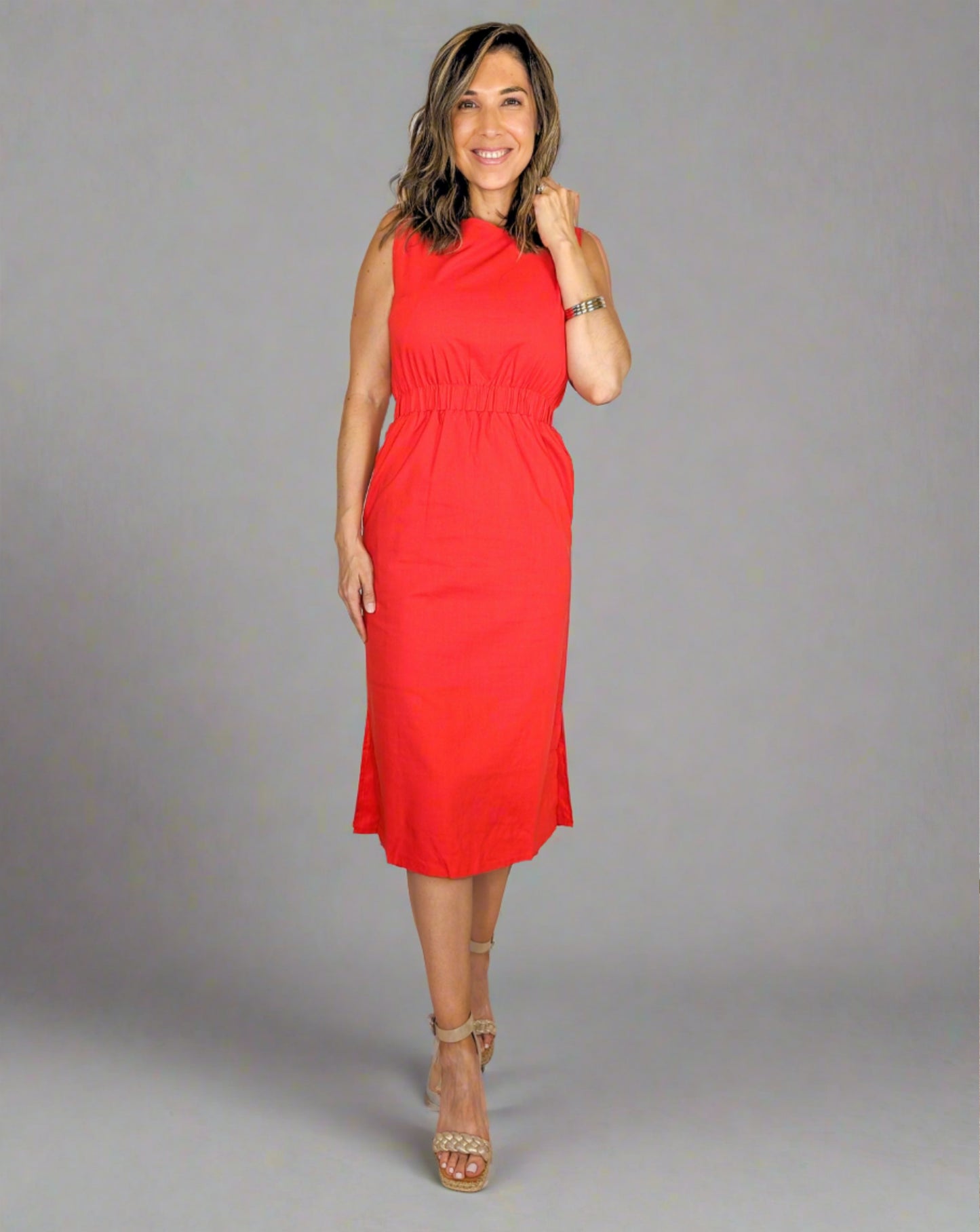 red midi length, high neck dress with pockets