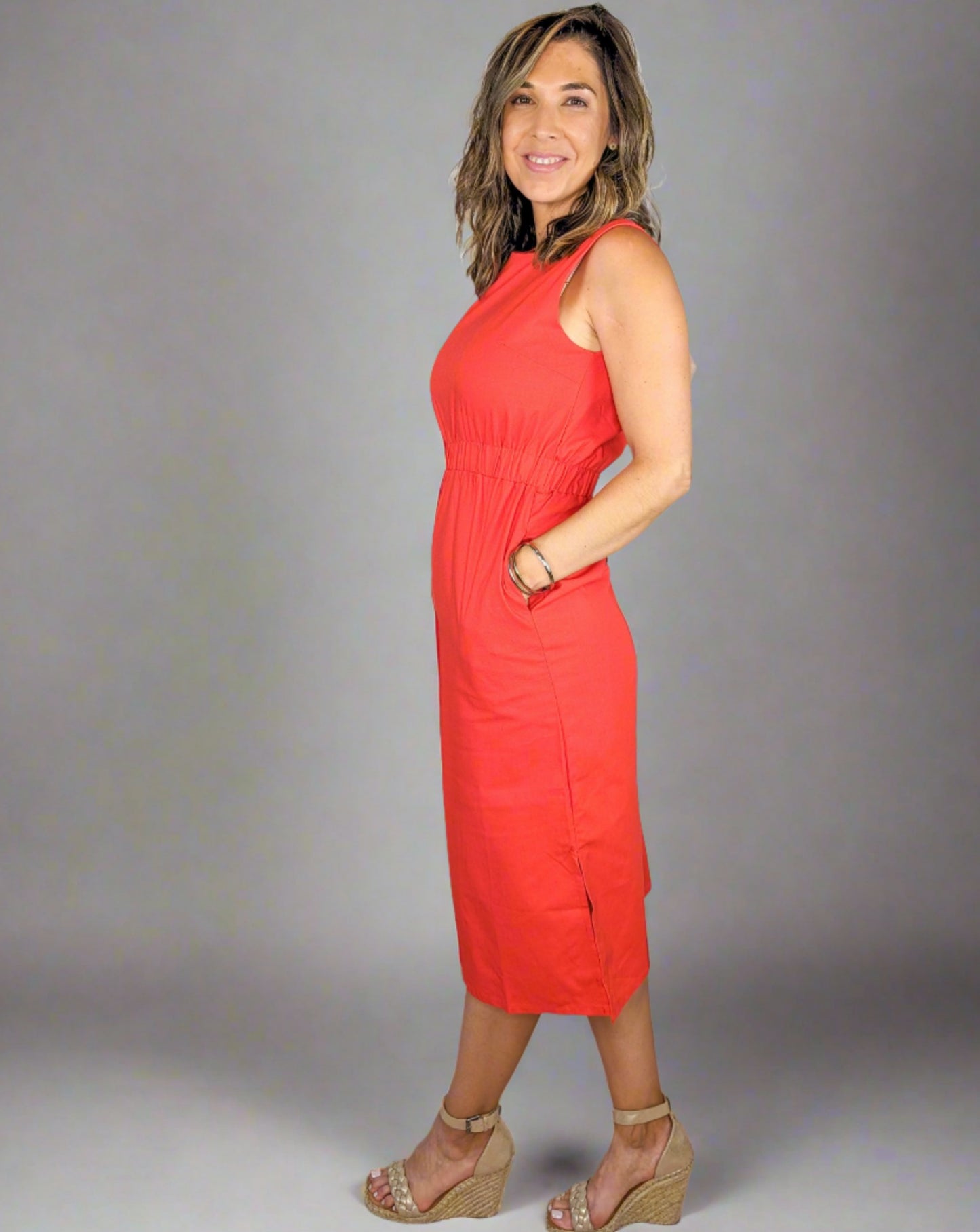 red midi length, high neck dress with pockets