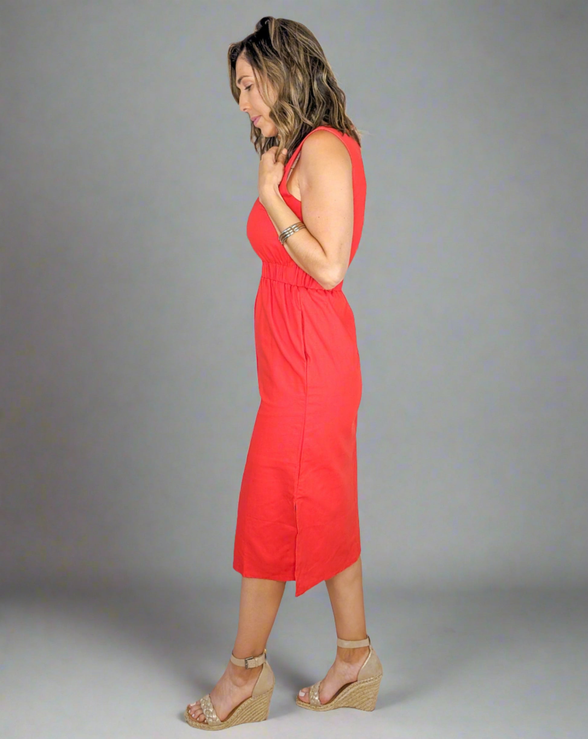 red midi length, high neck dress with pockets